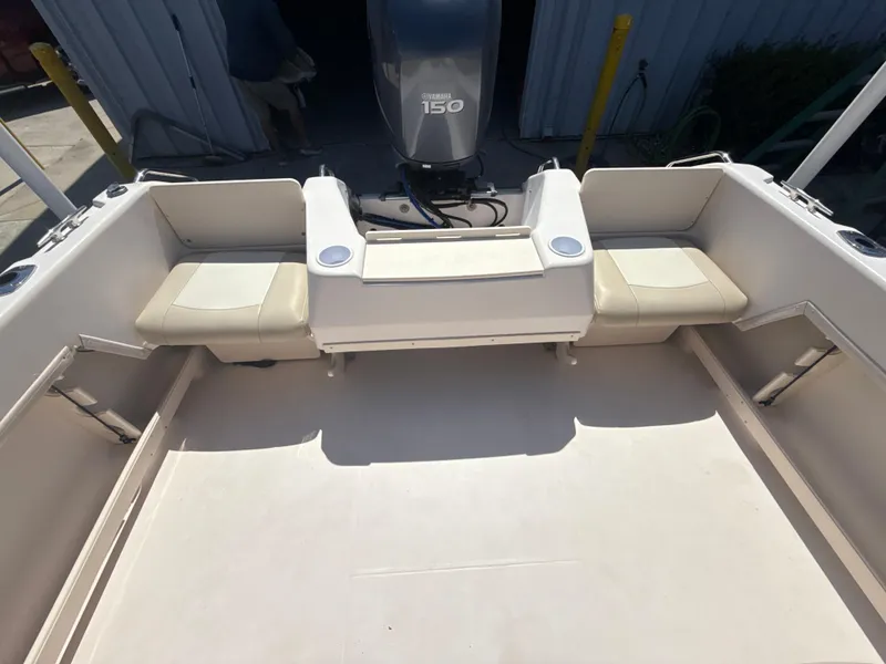 Slide: The Image of 2011 Grady-White Freedom 192 boat interior with seating and Yamaha 150 engine. - 22