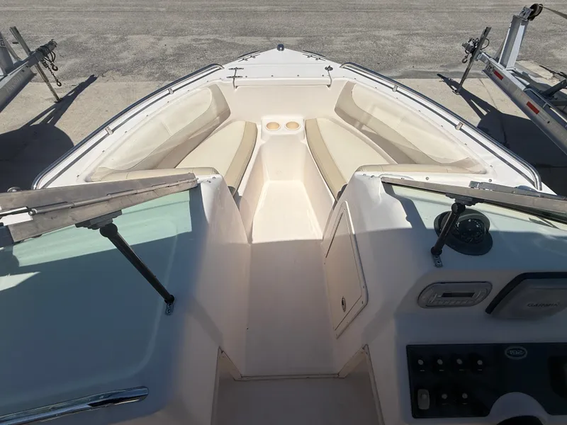 Slide: The Image of 2011 Grady-White Freedom 192 boat interior with seating and console view. - 26