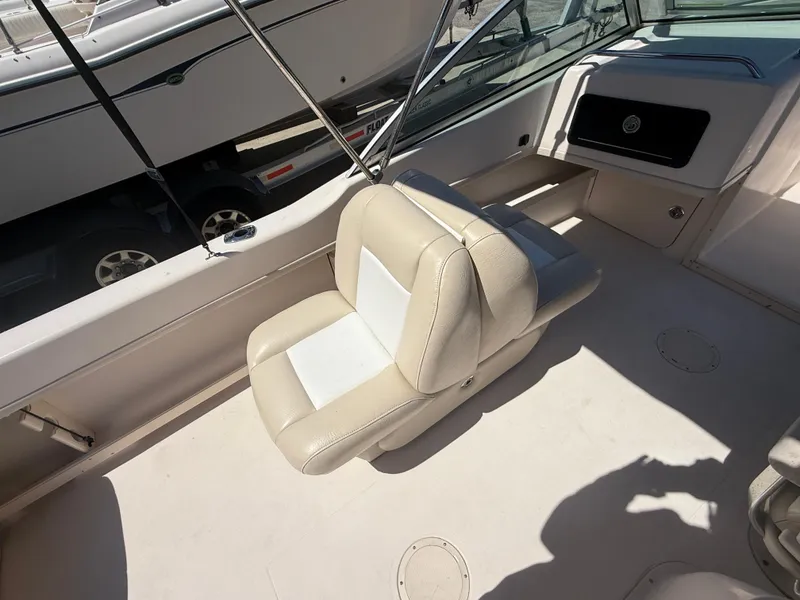 Slide: The Image of 2011 Grady-White Freedom 192 boat interior with beige seating. - 27