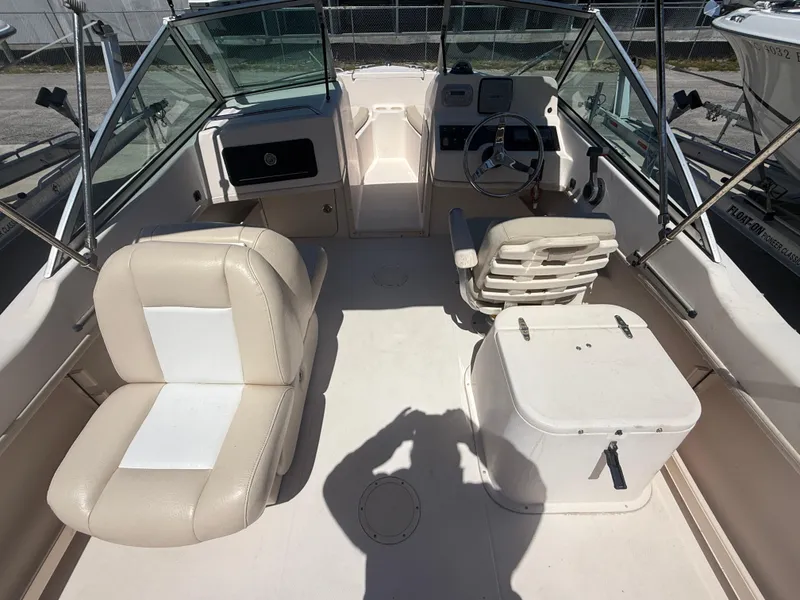 Slide: The Image of 2011 Grady-White Freedom 192 boat interior with seating and steering wheel. - 28