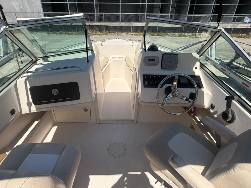 Slide: The Image of 2011 Grady-White Freedom 192 boat interior with steering wheel and seating. - 30