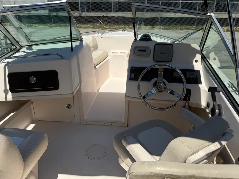 Slide: The Image of 2011 Grady-White Freedom 192 boat interior with steering wheel and seating area. - 31