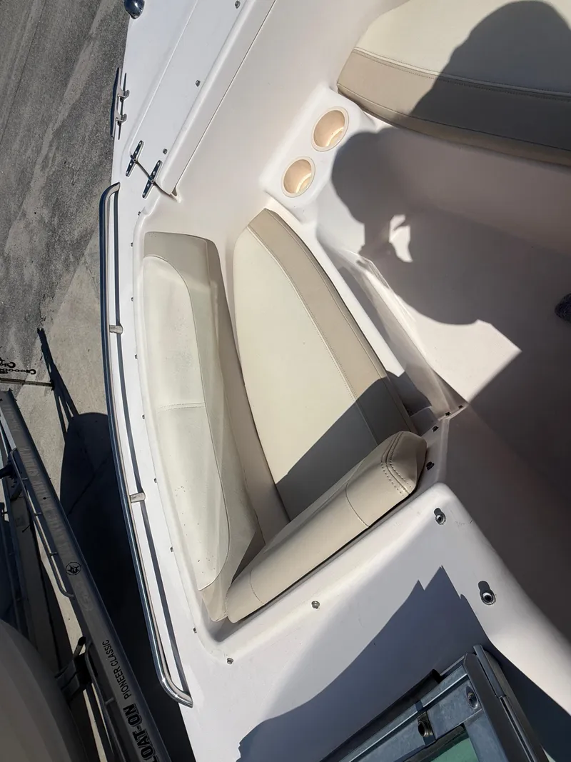 Slide: The Image of 2011 Grady-White Freedom 192 boat interior with cushioned seating. - 32