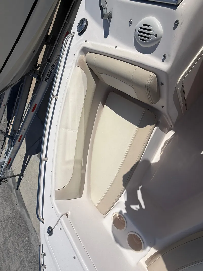 Slide: The Image of 2011 Grady-White Freedom 192 boat interior with beige seating and speaker. - 33