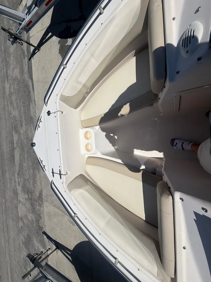 Slide: The Image of 2011 Grady-White Freedom 192 boat interior with beige seating and white deck. - 34