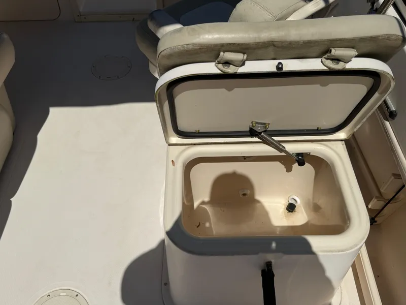 Slide: The Image of Open storage compartment on 2011 Grady-White Freedom 192 boat deck. - 35