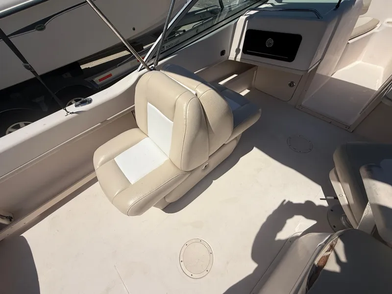 Slide: The Image of 2011 Grady-White Freedom 192 boat interior with beige seating and dashboard. - 37