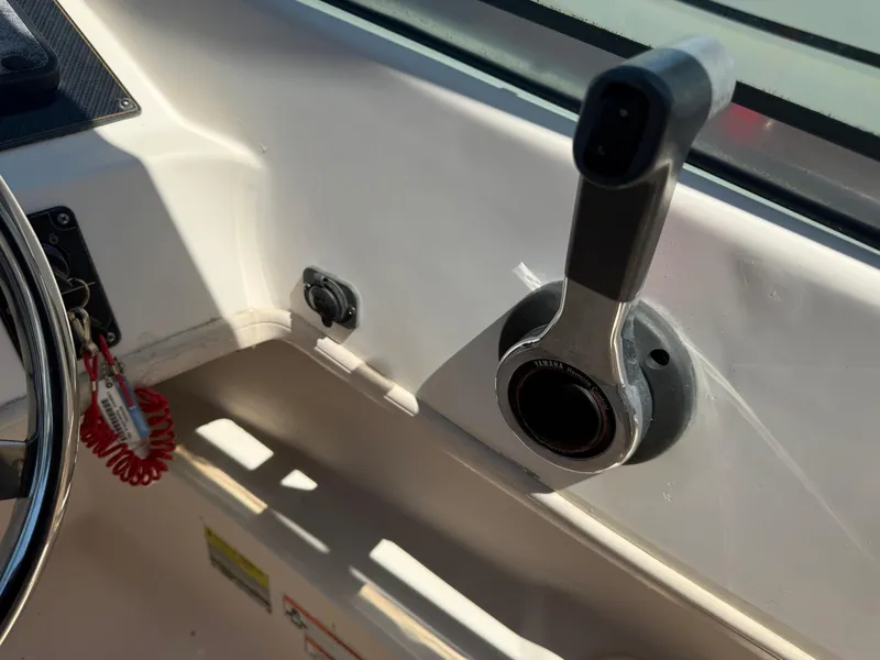 Slide: The Image of Throttle control of 2011 Grady-White Freedom 192 boat cockpit. - 39