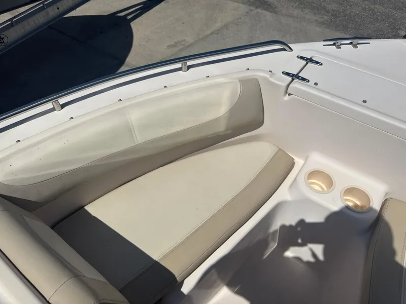 Slide: The Image of 2011 Grady-White Freedom 192 boat interior with beige seating and cup holders. - 40