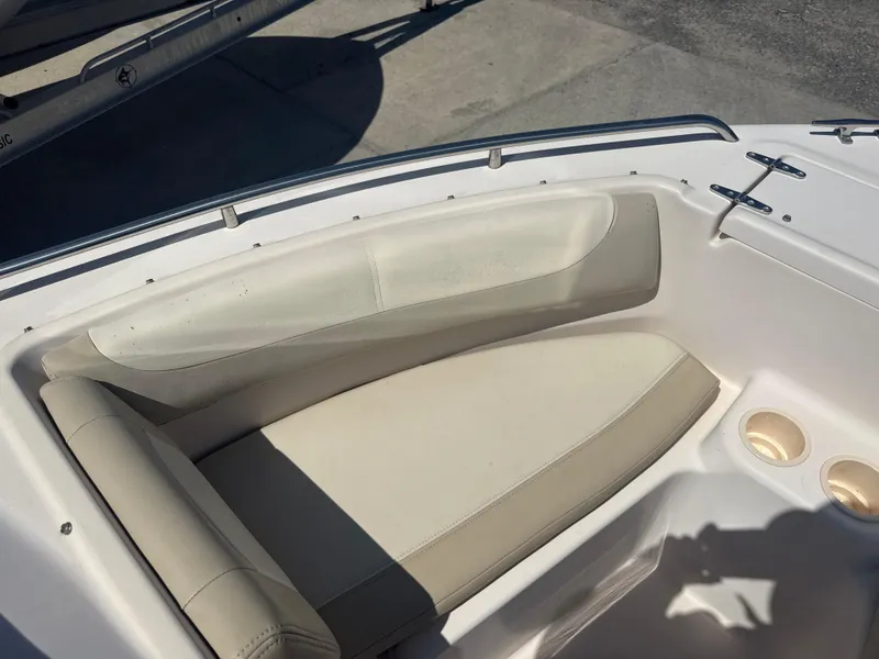 Slide: The Image of 2011 Grady-White Freedom 192 boat interior with cushioned seating and cup holders. - 43