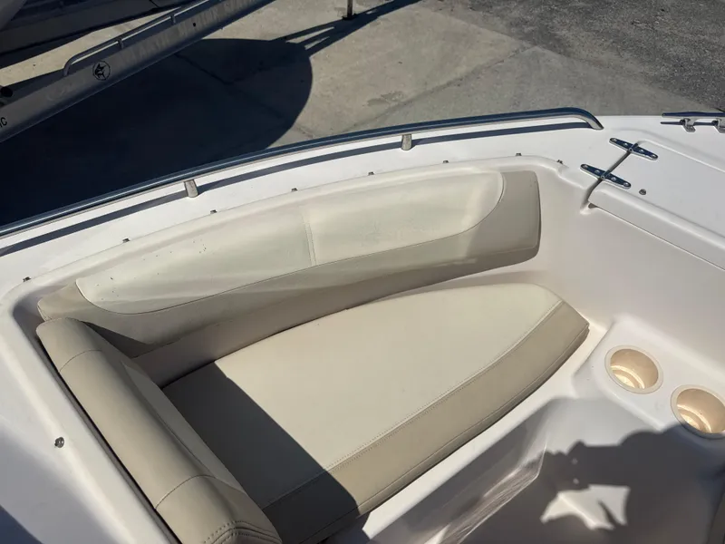 Slide: The Image of 2011 Grady-White Freedom 192 boat interior with beige seating and cup holders. - 44