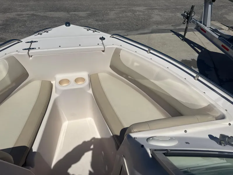 Slide: The Image of 2011 Grady-White Freedom 192 boat interior with beige seating and cup holders. - 46