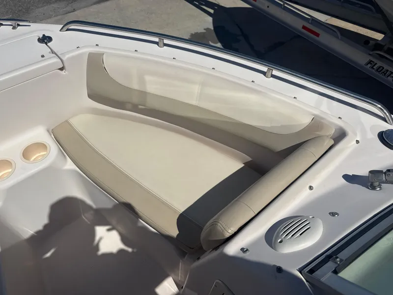 Slide: The Image of 2011 Grady-White Freedom 192 boat interior with beige seating and speaker. - 47