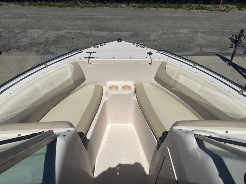 Slide: The Image of 2011 Grady-White Freedom 192 boat interior with beige seating and cup holders. - 48