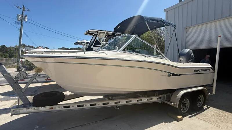 Slide: The Image of 2011 Grady-White Freedom 192 boat on trailer, parked outdoors. - 7