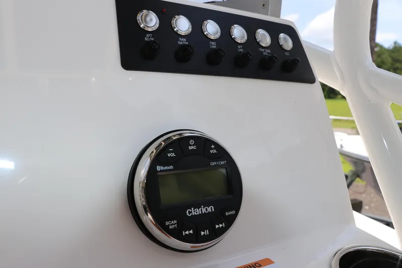 Slide: The Image of Control panel of 2025 Robalo 206 Cayman boat with Clarion audio system. - 19