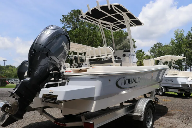 Slide: The Image of 2025 Robalo 206 Cayman boat with Yamaha engine on trailer, outdoors. - 4