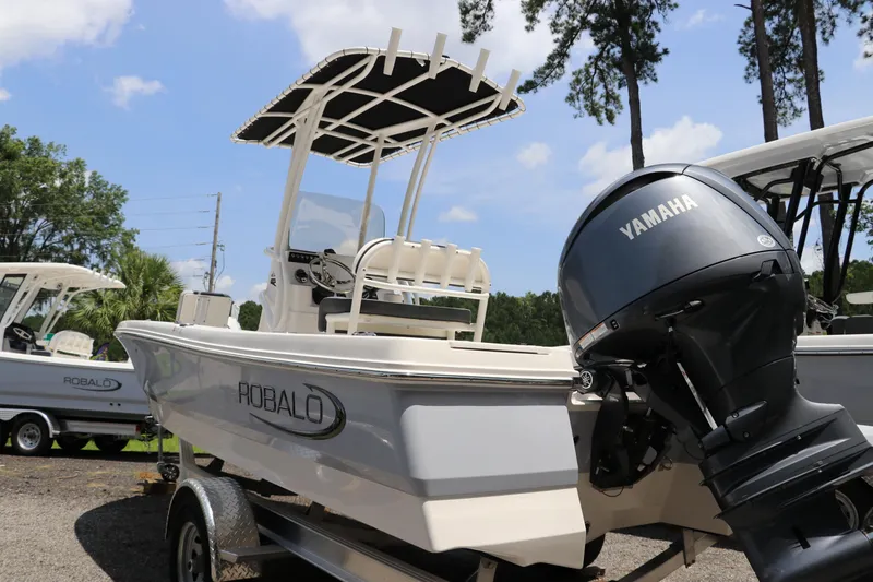 Slide: The Image of 2025 Robalo 206 Cayman boat with Yamaha engine, parked outdoors on a trailer. - 5