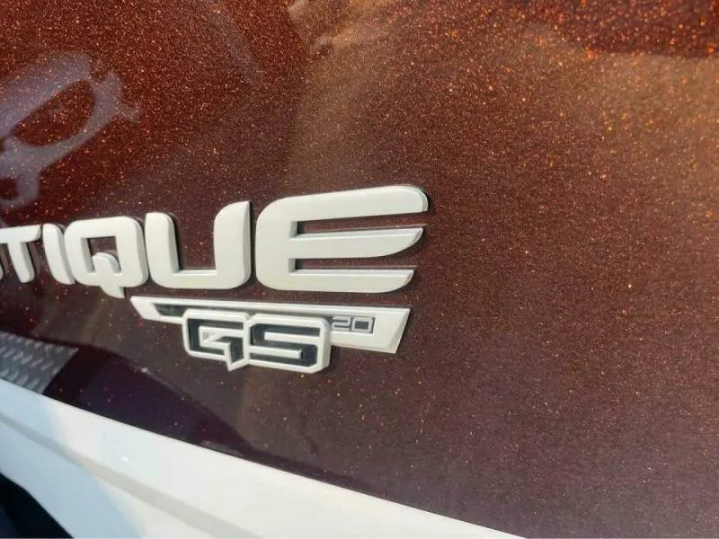 Slide: The Image of 2017 Correct Craft Super Air Nautique GS20 logo on metallic brown surface. - 16