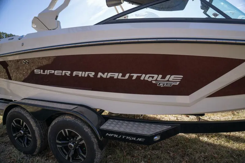Slide: The Image of 2017 Correct Craft Super Air Nautique GS boat on trailer, side view. - 17