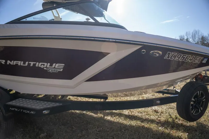 Slide: The Image of 2017 Correct Craft Super Air Nautique GS boat on trailer, side view in sunlight. - 18