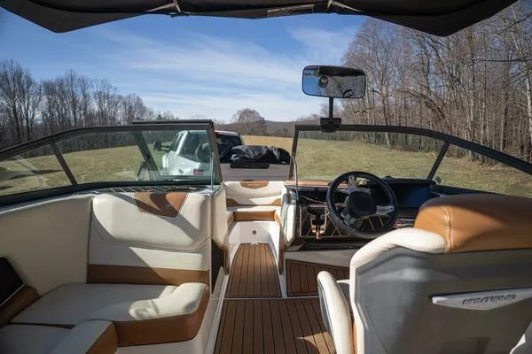 Slide: The Image of Interior of 2017 Correct Craft Super Air Nautique GS boat with luxurious seating and steering. - 36