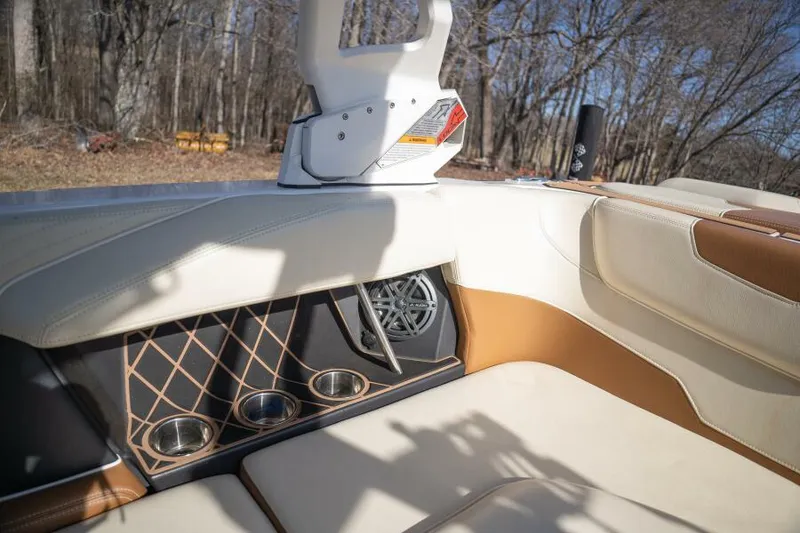 Slide: The Image of Interior of 2017 Correct Craft Super Air Nautique GS boat with cup holders and speaker. - 42