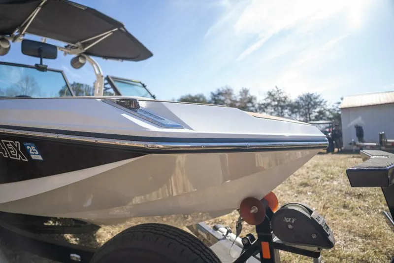 Slide: The Image of 2017 Correct Craft Super Air Nautique GS boat on trailer, sunny day. - 46