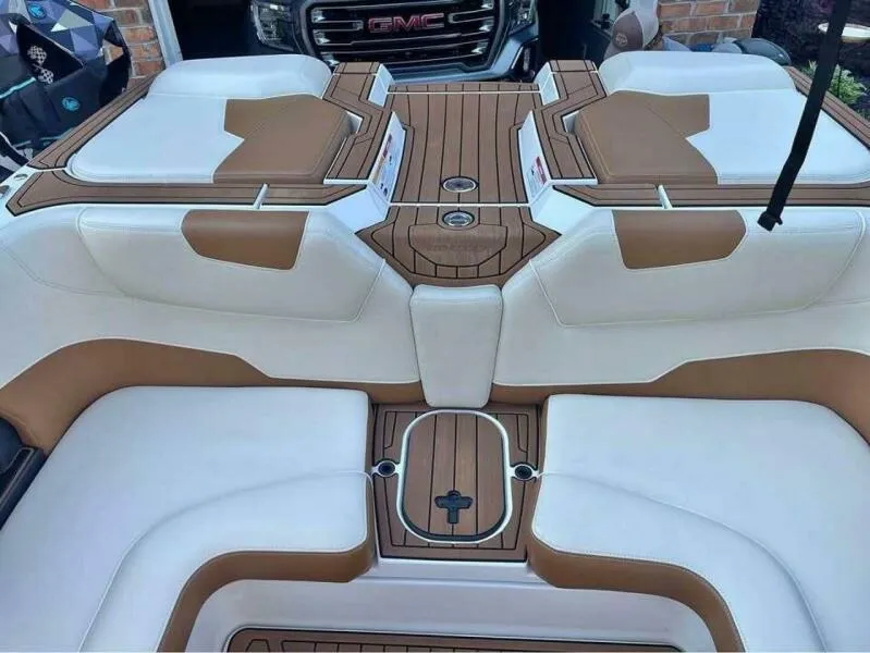Slide: The Image of 2017 Correct Craft Super Air Nautique GS interior with tan and white seating. - 9