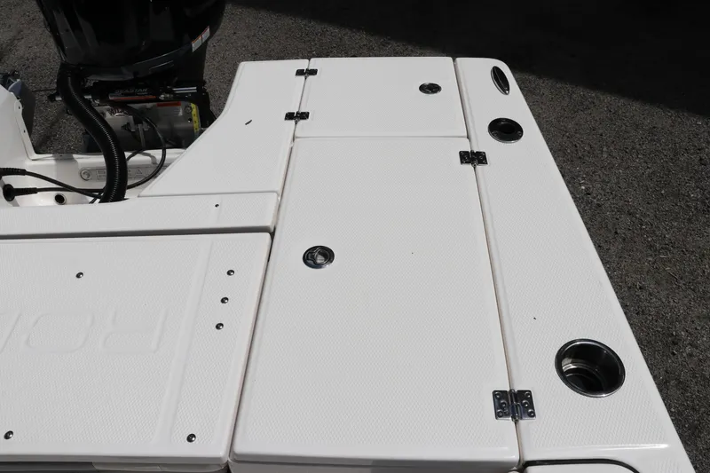 Slide: The Image of 2025 Robalo 226 Cayman boat deck with storage compartments and cup holders. - 12