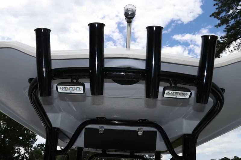 Slide: The Image of 2025 Robalo 226 Cayman boat T-top with rod holders and LED lights. - 16