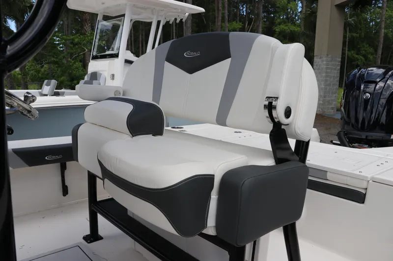 Slide: The Image of 2025 Robalo 226 Cayman boat interior with cushioned seating and modern design. - 18
