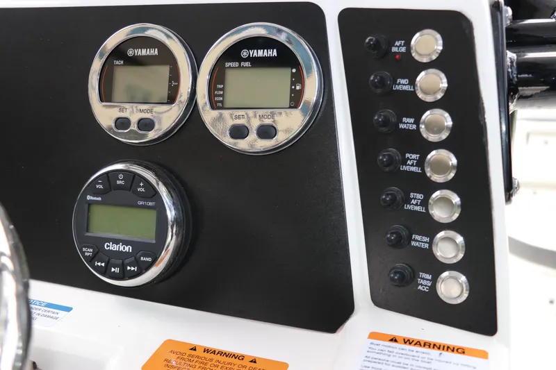 Slide: The Image of Control panel of 2025 Robalo 226 Cayman boat with Yamaha gauges and Clarion audio system. - 22