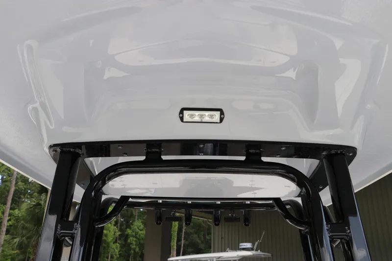 Slide: The Image of 2025 Robalo 226 Cayman T-top with integrated LED light, showcasing sleek design. - 25