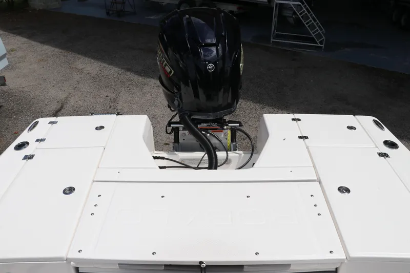 Slide: The Image of 2025 Robalo 226 Cayman boat with outboard motor, rear deck view. - 9