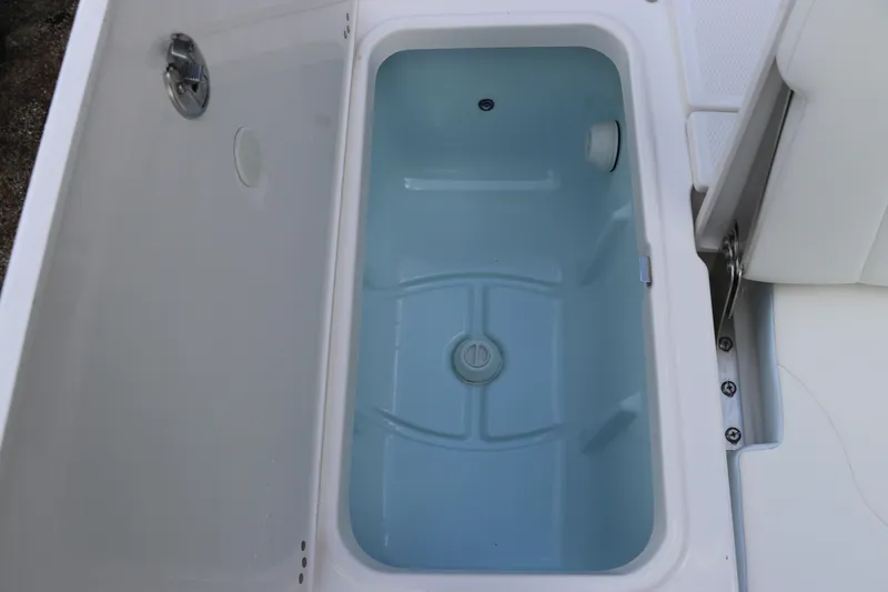 Slide: The Image of Livewell compartment on 2025 Robalo 226 Cayman boat, filled with water. - 11