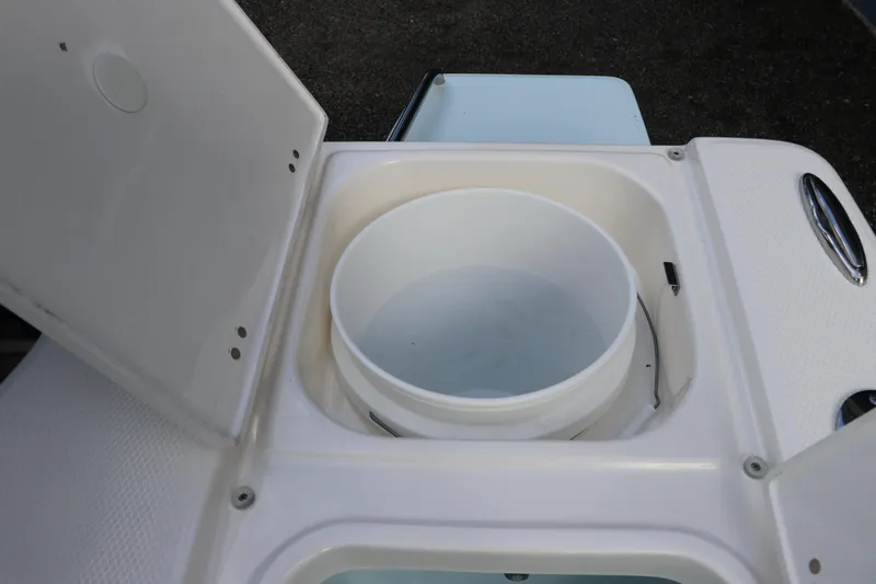 Slide: The Image of Open storage compartment on 2025 Robalo 226 Cayman boat. - 15
