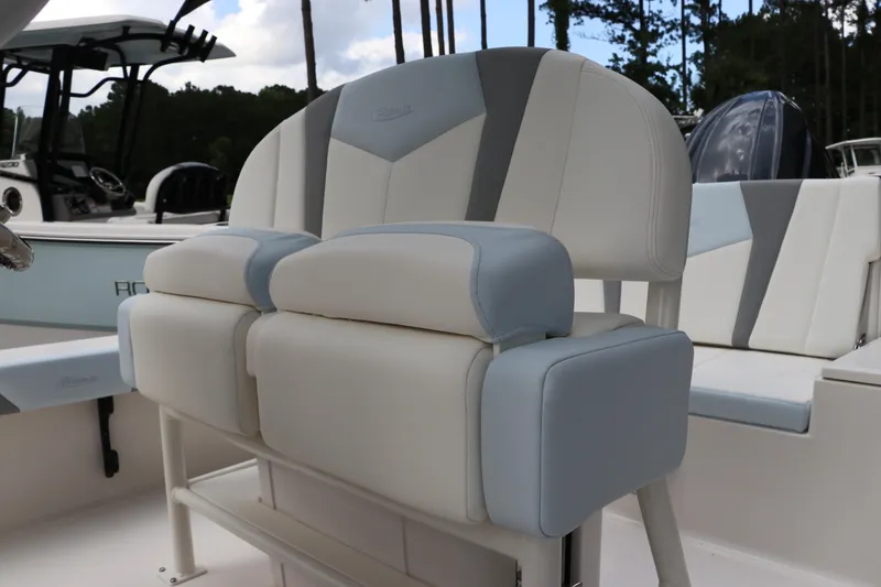 Slide: The Image of 2025 Robalo 226 Cayman boat seating with cushioned backrest and armrests. - 20