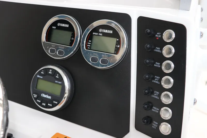 Slide: The Image of Control panel of 2025 Robalo 226 Cayman boat with Yamaha gauges and Clarion audio system. - 25