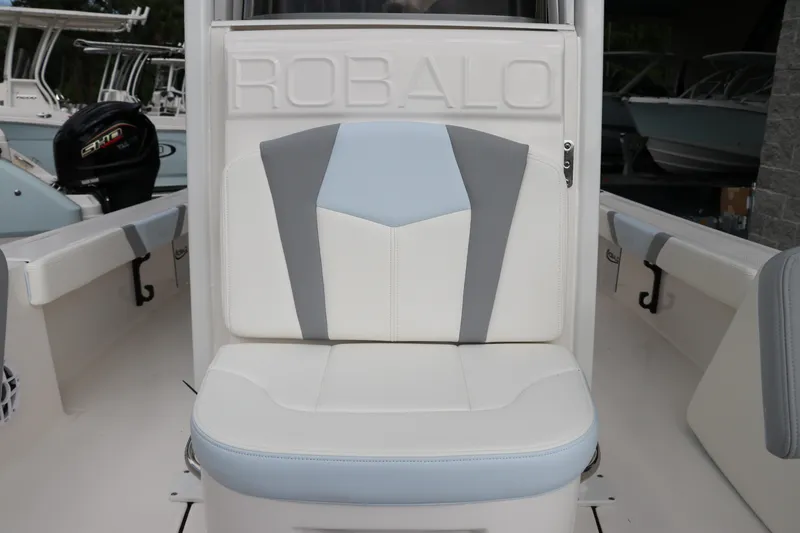 Slide: The Image of 2025 Robalo 226 Cayman boat seat with stylish gray and blue accents. - 28