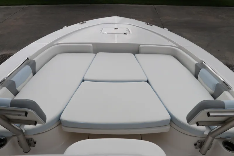 Slide: The Image of 2025 Robalo 226 Cayman boat with cushioned bow seating area. - 38