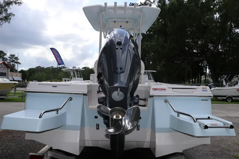 Slide: The Image of 2025 Robalo 226 Cayman boat rear view with outboard motor and swim platforms. - 5