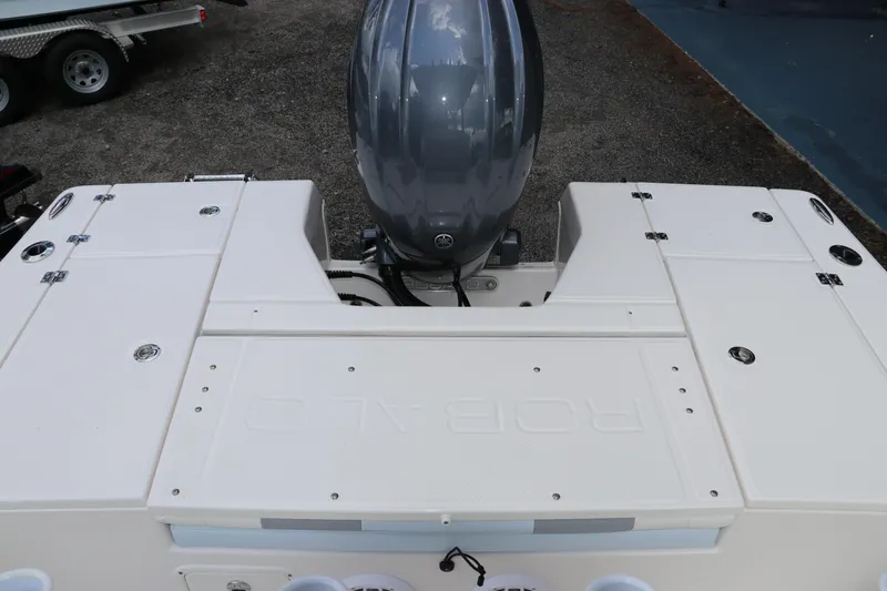 Slide: The Image of 2025 Robalo 226 Cayman boat with outboard motor, rear deck view. - 8