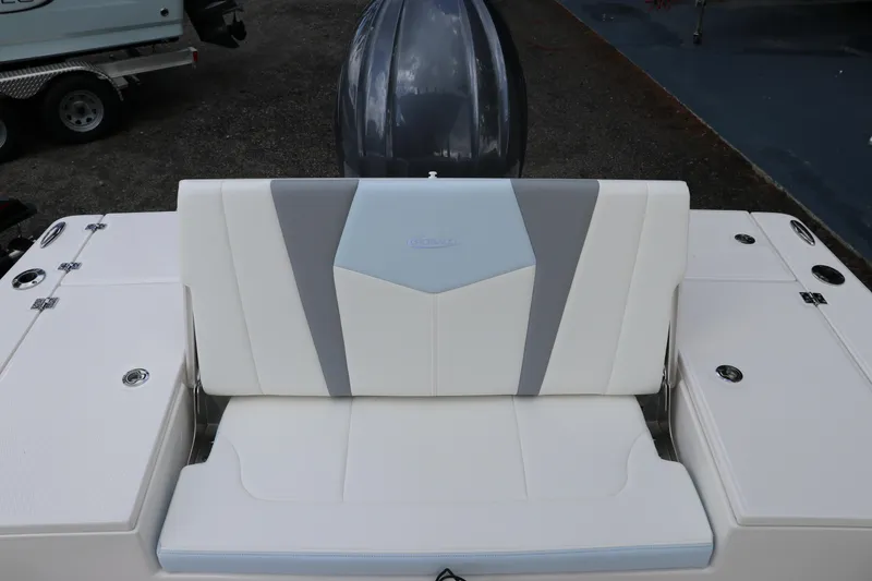 Slide: The Image of 2025 Robalo 226 Cayman boat seat with sleek white and gray design. - 9