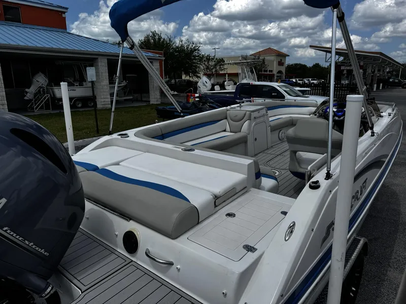Slide: The Image of 2020 Starcraft MDX 211 OB boat with spacious seating, docked under a cloudy sky. - 14