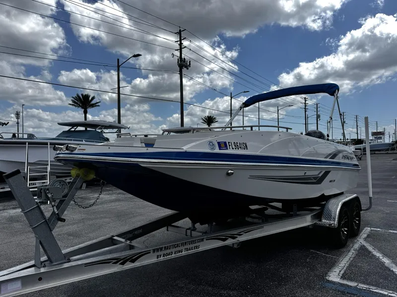Slide: The Image of 2020 Starcraft MDX 211 OB boat on trailer under cloudy sky. - 4