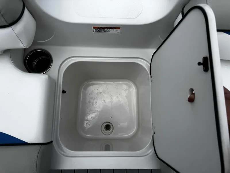 Slide: The Image of Open storage compartment on 2020 Starcraft MDX 211 OB boat. - 7