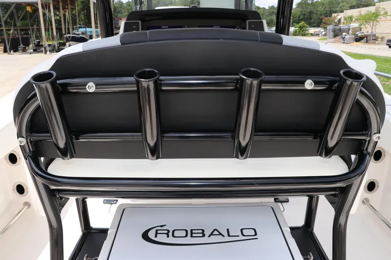 Slide: The Image of 2024 Robalo R230 Center Console boat with rod holders and branded seating. - 12