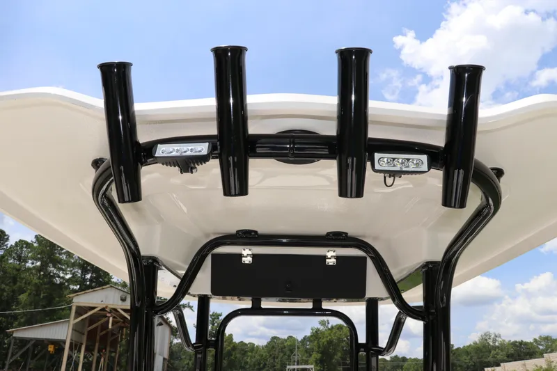 Slide: The Image of 2024 Robalo R230 Center Console T-top with rod holders and LED lights. - 13