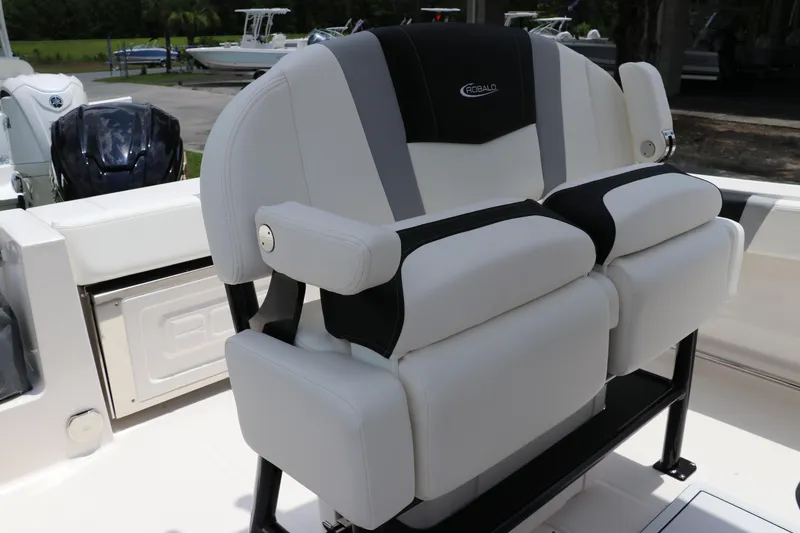 Slide: The Image of 2024 Robalo R230 Center Console boat seat, featuring sleek white and black design. - 14